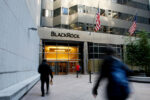 BlackRock workers outside the firm's headquarters in New York. The asset manager has been a target for an anti-ESG campaign.