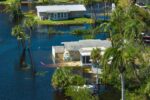 Image of homes in Florida surrounded by flood waters