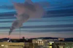 A plume of smoke being emitted into the air from a power plant, Feb. 16, 2022, in Fairbanks, Alaska.