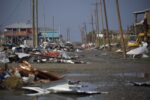 Debris sits outside of damaged homes after Hurricane Delta made landfall in Holly Beach, La., Oct. 11, 2020.