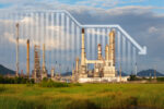 Oil refinery is shown with a graph line superimposed over it.