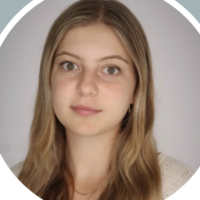 Headshot of a person with long, light brown hair and a neutral expression.