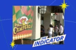 Cover art for the Indicator from Planet Money podcast with an image of a group of people standing in a restaurant with a sign that says Pollo Campero on a blue background with yellow stars.