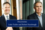 Luke Taylor and Robert Stambaugh smile in business apparrel with text reading Discoveries: Luke Taylor and Robert Stambaugh